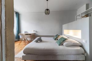 Ένα ή περισσότερα κρεβάτια σε δωμάτιο στο Le Ballainvilliers - Appartement cœur de ville