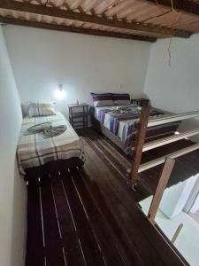 Ένα ή περισσότερα κρεβάτια σε δωμάτιο στο Chalé do galo