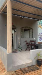 a christmas tree on the porch of a house at Chalé do galo in São Domingos +35 photos