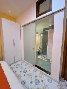 a bathroom with a shower and a toilet at Sorrento Street View in Sorrento +67 photos
