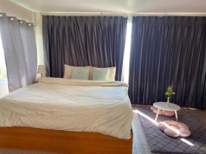 Postel nebo postele na pokoji v ubytování Anna House Doichang + 5 fotografií