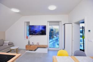 a living room with a couch and a table at Apartmán Relax Pernink in Pernink