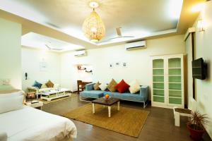 Rúm í herbergi á Anara Service Apartments - Greater Kailash Part II