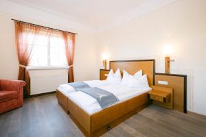 Ένα ή περισσότερα κρεβάτια σε δωμάτιο στο Gasthof Hotel Jägerwirt
