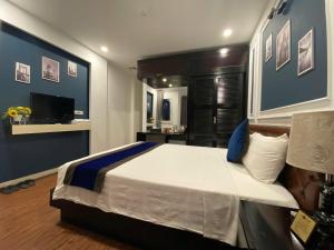 Voodi või voodid majutusasutuse Eclipse Legend Hotel toas