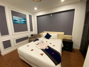 Voodi või voodid majutusasutuse Eclipse Legend Hotel toas