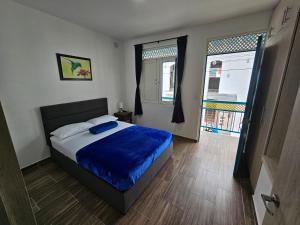 Postel nebo postele na pokoji v ubytování APARTAHOTEL DON BELI