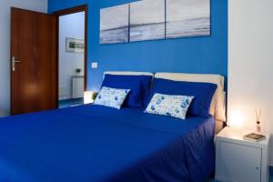 Katil atau katil-katil dalam bilik di AMORE RENTALS - Appartamento Louise