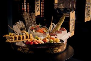 a plate of food on a table with snacks at FIVE LUXE in Dubai +119 photos