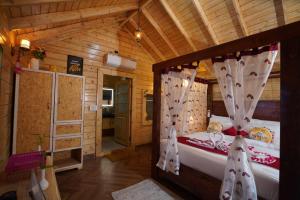 a bedroom with two beds in a wooden cabin at Lovely Wooden Cottage KPHB Phase 15 in Hyderabad
