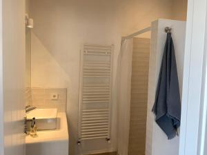 a small bathroom with a sink and a shower at Blue Door Mallorca in Caʼs Concos +39 photos