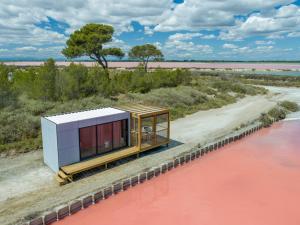 a rendering of a house on the side of a river at Nuits Salines Aigues-Mortes in Aigues-Mortes +5 photos