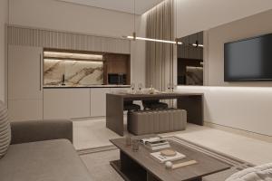 a living room with a couch and a tv at فندق ليورا Liora Hotel in Riyadh