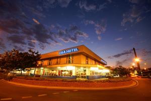 a building with a sign on the side of it at Isa Hotel in Mount Isa