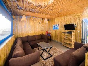 a living room with a couch and a television at Casa Barhoun in Chefchaouen