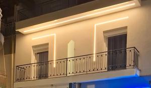 a building with a balcony with lights on it at Αικατερίνα in Kozani
