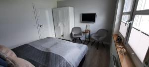 En eller flere senge i et værelse på Hafenglück