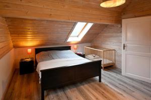a bedroom with a large bed in a attic at Fehmarn Ostseeferien Landliebe Fehmarn 117 in Fehmarn