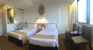 En eller flere senger på et rom på Best Western Plus Tsim Sha Tsui
