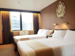 En eller flere senger på et rom på Best Western Plus Tsim Sha Tsui