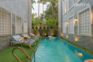 a pool in the backyard of a villa at EKOSTAY - Grey Goose Villa in Calangute