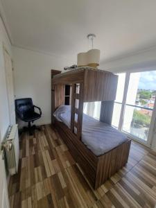 En eller flere senge i et værelse på Edificio Duble Santiago del Estero - alquiler minimo 15 dias