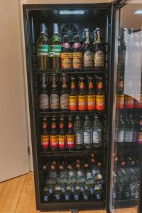 a refrigerator filled with lots of bottles of beer at Ferienhaus Waldtraum Winterberg in Winterberg