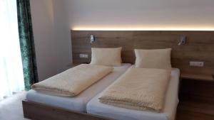 Giường trong phòng chung tại Ferienwohnung Scharfetter Anna