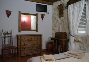 Телевизор и/или развлекательный центр в Casa Rural La Abuela Marcelina