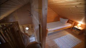 an overhead view of a wooden cabin with a bench at Almdorf Präbichl in Vordernberg