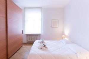 Ένα ή περισσότερα κρεβάτια σε δωμάτιο στο VeronaVera Anfiteatro