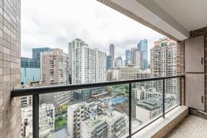 a balcony with a view of a city at Jinxin B&B in Chongqing