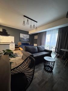a living room with a couch and a table at APARTAMENTY CENTRUM in Kostrzyn nad Odrą