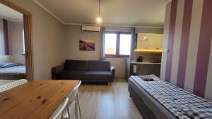 Postel nebo postele na pokoji v ubytování Wrzosowe Wzgórze Apartamenty