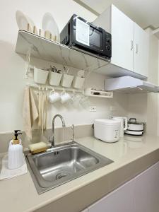 Η κουζίνα ή μικρή κουζίνα στο DC Trees Residences Staycation