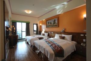 Postel nebo postele na pokoji v ubytování Emilia Resort I
