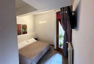 Postel nebo postele na pokoji v ubytování B&B Alla Casa di Lucia