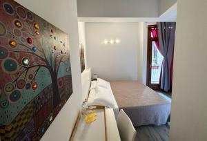 Postel nebo postele na pokoji v ubytování B&B Alla Casa di Lucia