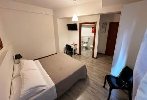 Postel nebo postele na pokoji v ubytování B&B Alla Casa di Lucia