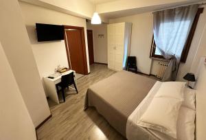 Postel nebo postele na pokoji v ubytování B&B Alla Casa di Lucia