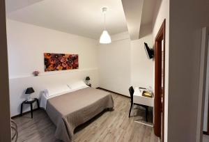 Postel nebo postele na pokoji v ubytování B&B Alla Casa di Lucia