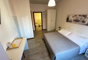 Postel nebo postele na pokoji v ubytování B&B Alla Casa di Lucia