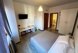 Postel nebo postele na pokoji v ubytování B&B Alla Casa di Lucia
