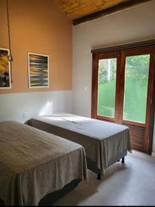 Postel nebo postele na pokoji v ubytování Casa de Praia, Paraíso Verde