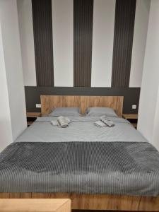 Giường trong phòng chung tại Jagodić lux