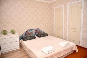 Postel nebo postele na pokoji v ubytování 1-к квартира, Харківська, ТЦ Мануфактура