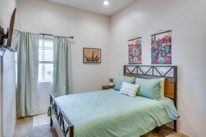 a bedroom with a bed and a window at Game Day Hub! 1 Mi to AU and Arizona Stadium in Tucson