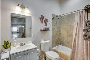 a bathroom with a toilet and a sink and a shower at Game Day Hub! 1 Mi to AU and Arizona Stadium in Tucson +18 photos
