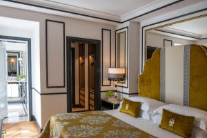 Giường trong phòng chung tại Hotel d’Inghilterra Roma – Starhotels Collezione