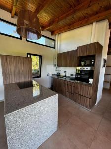a kitchen with a counter top in a room at Sierras de Córdoba Ascochinga vivienda Privada in Ascochinga +22 photos